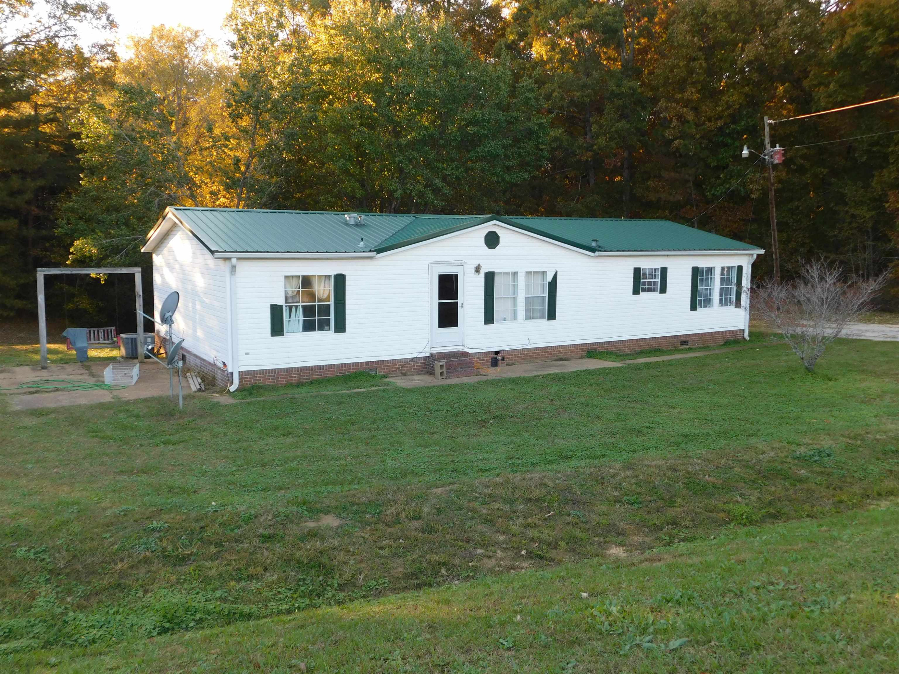 479 Fowler Road Beech Bluff, TN 38313 - Photo 2 of 18 a front view of house with yard and green space