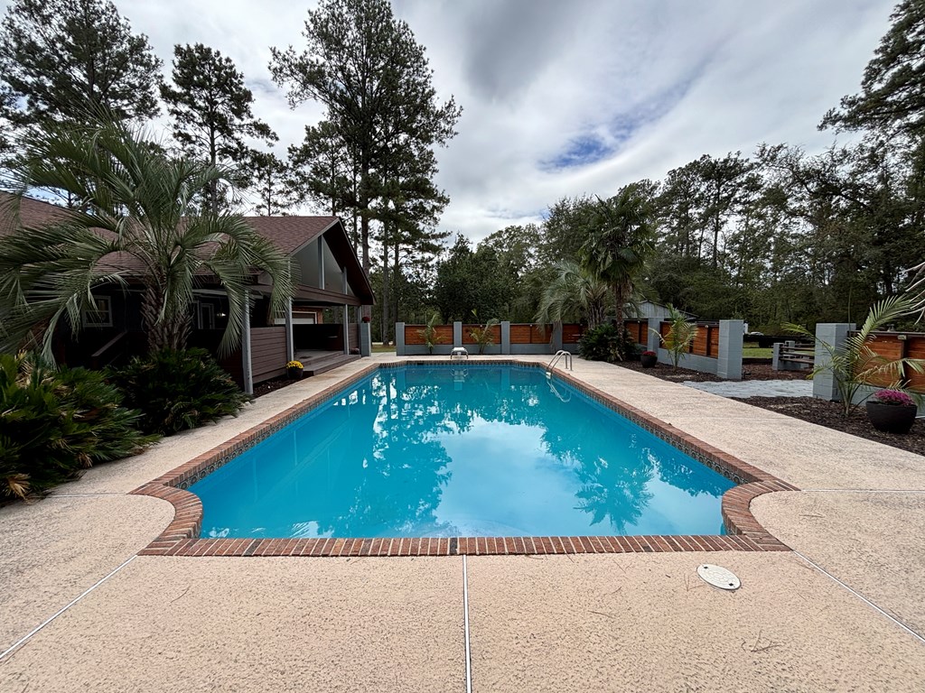 142 Gammage Road Eufaula, AL 36027 - Photo 11 of 47 a view of a swimming pool with a outdoor seating