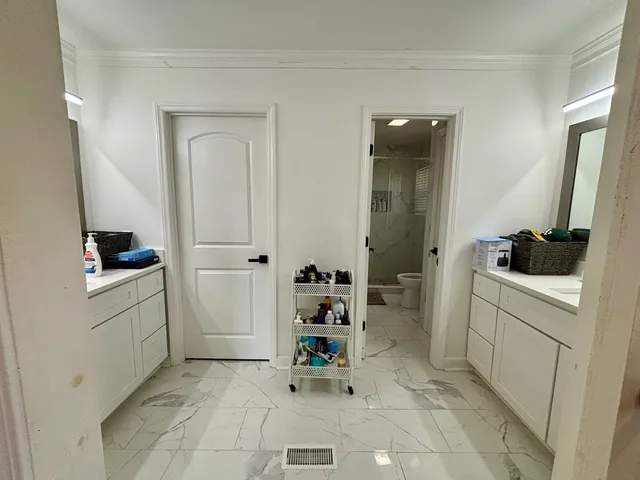 a utility room with sink dryer and washer