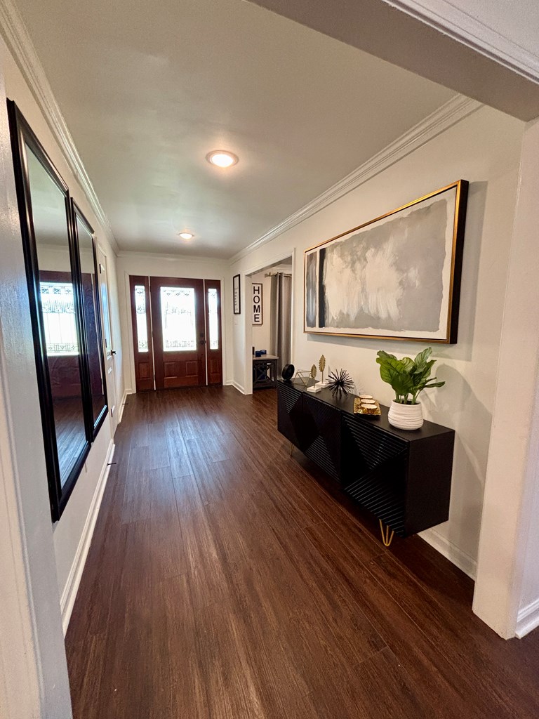 142 Gammage Road Eufaula, AL 36027 - Photo 26 of 47 a living room with couch wooden floor and a flat screen tv