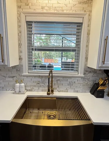 a bathroom with a bathtub and a sink