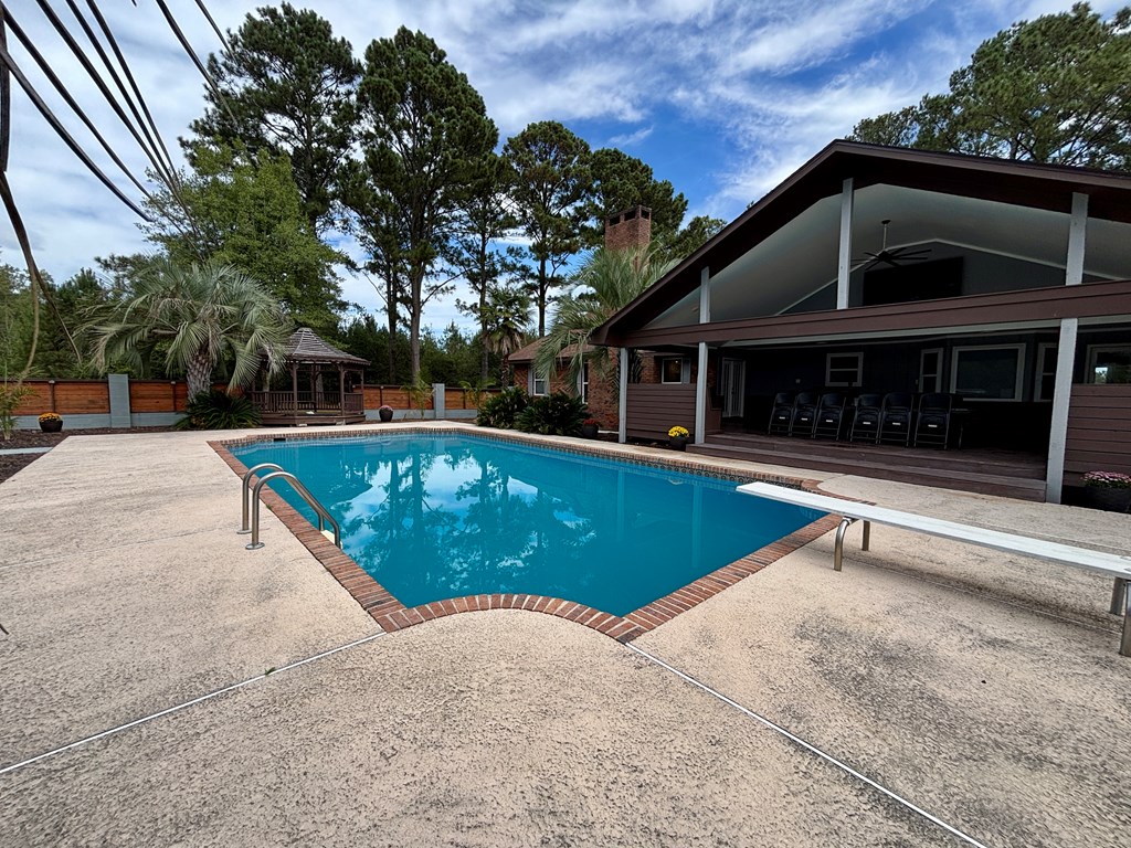 142 Gammage Road Eufaula, AL 36027 - Photo 10 of 47 a view of a swimming pool with a patio