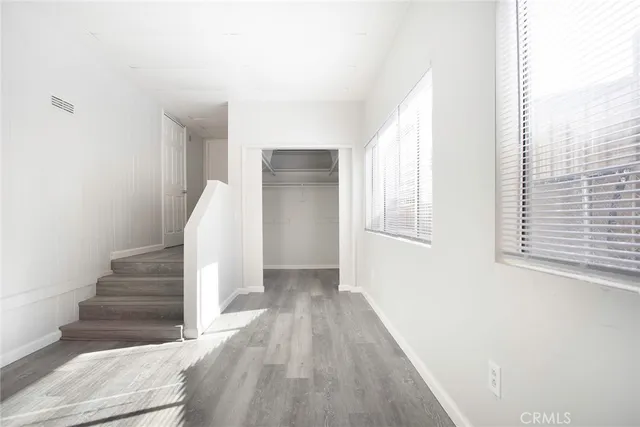 a view of entryway with wooden floor