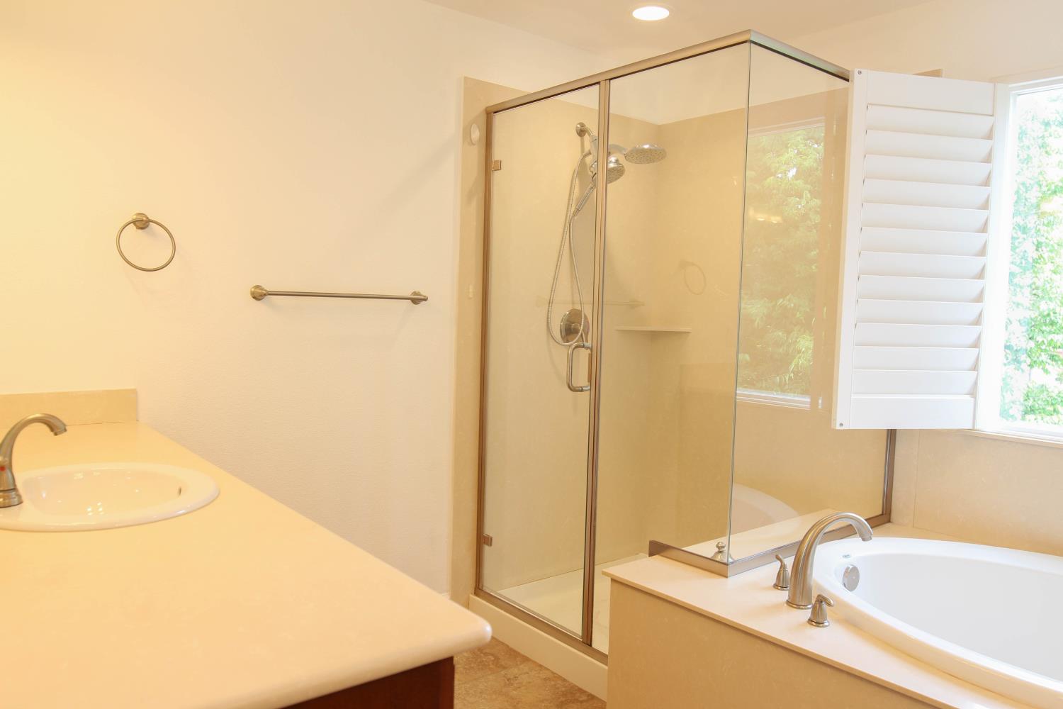 1817 Thomas Court Modesto, CA 95355 - Photo 14 of 20 a bathroom with a sink a toilet and shower