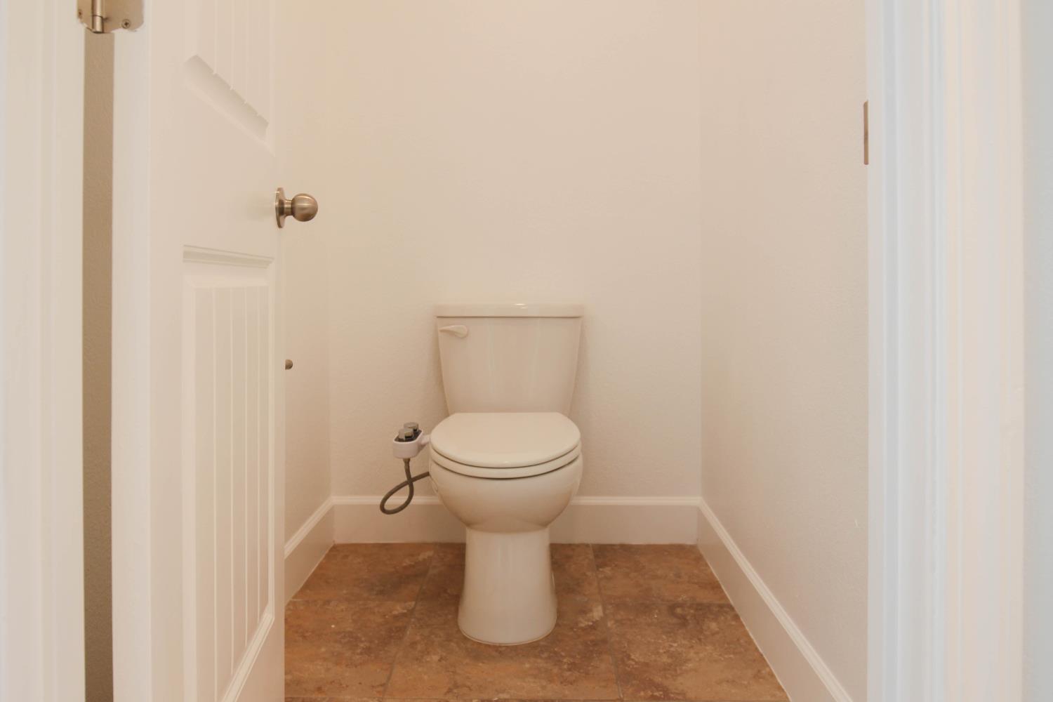 1817 Thomas Court Modesto, CA 95355 - Photo 16 of 20 a bathroom with a toilet and a sink