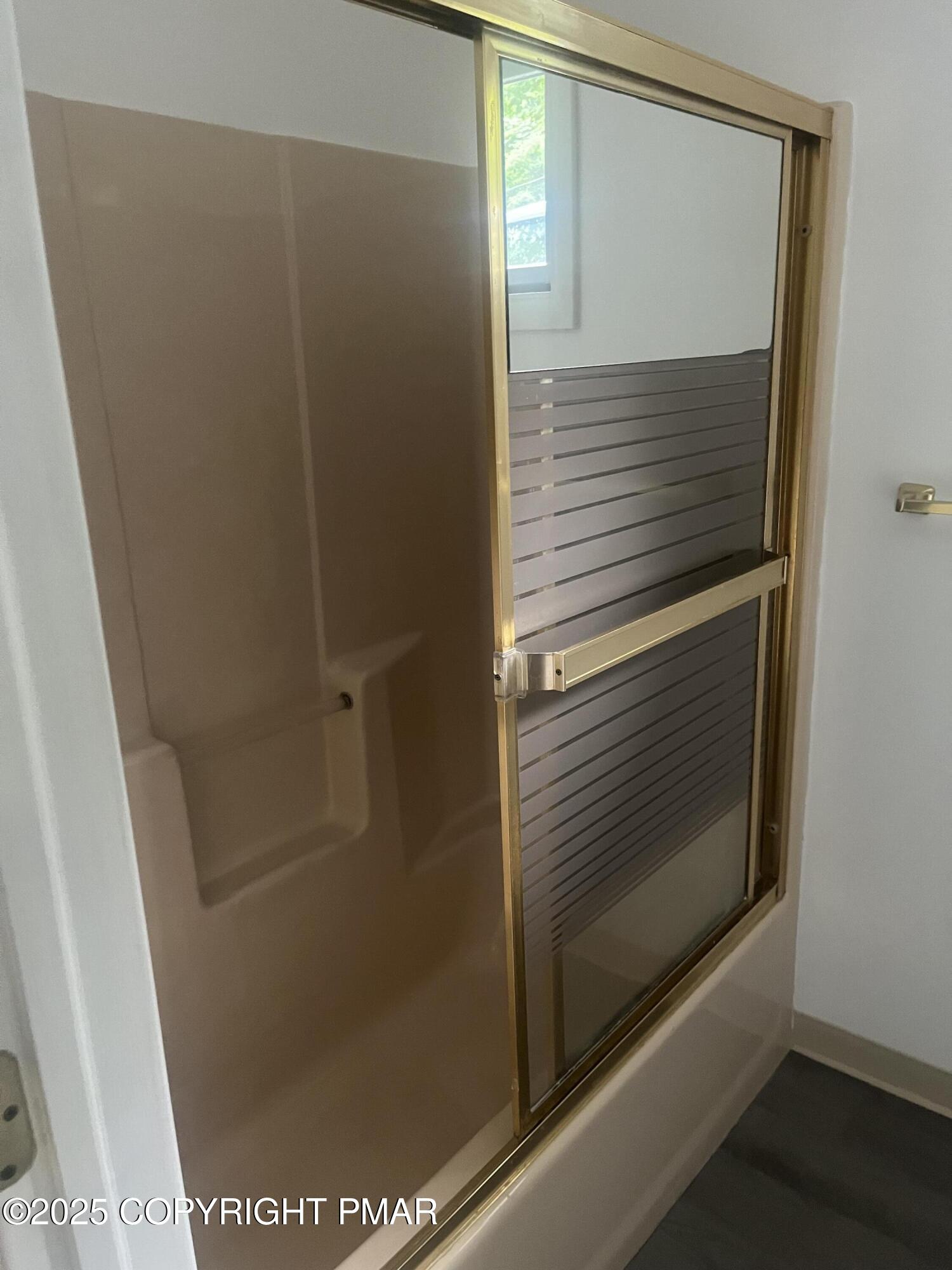 529 Pine Ridge Road Stroudsburg, PA 18360 - Photo 14 of 36 a bathroom with a glass shower door