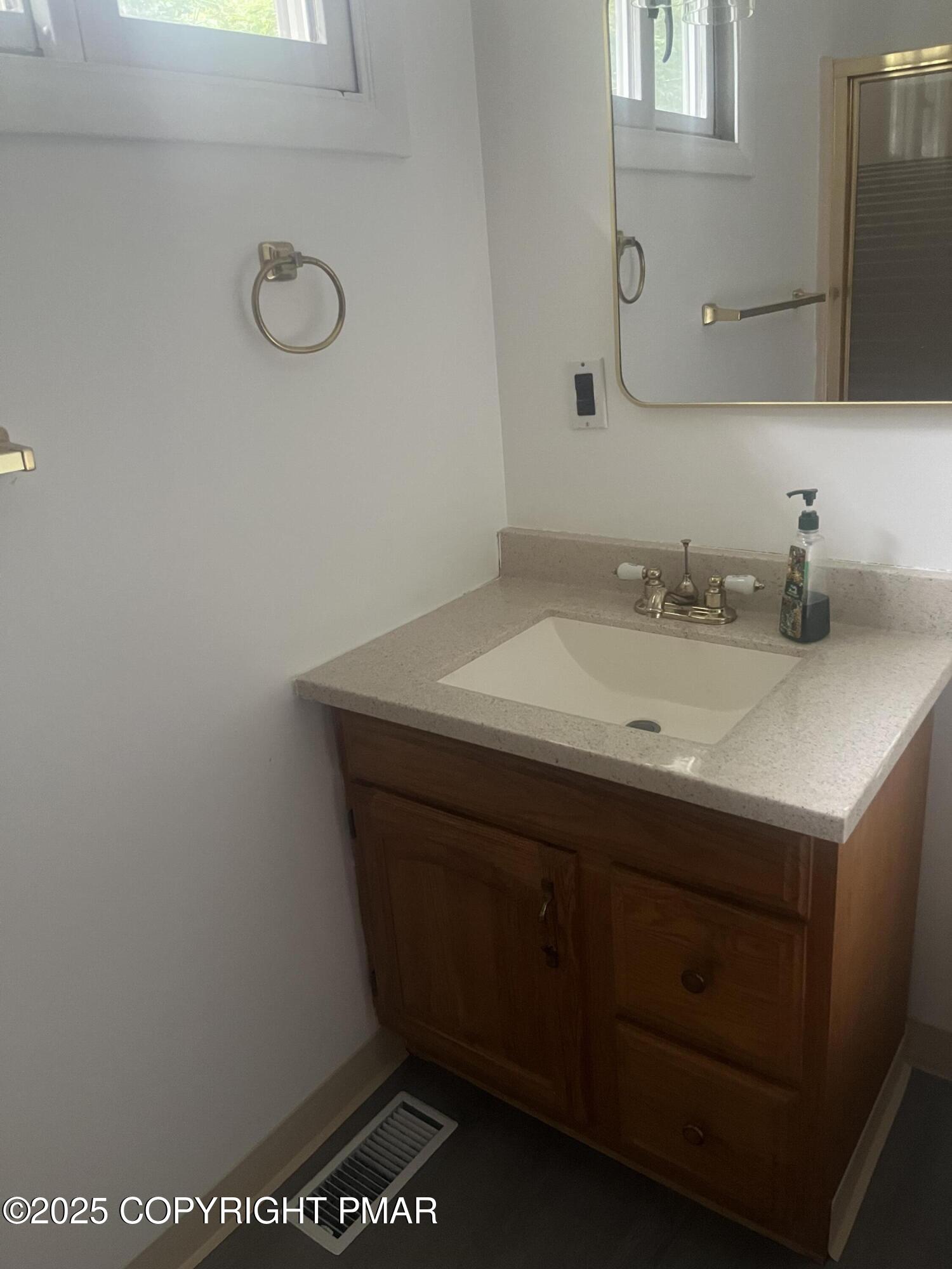 529 Pine Ridge Road Stroudsburg, PA 18360 - Photo 15 of 36 a bathroom with a sink and a mirror