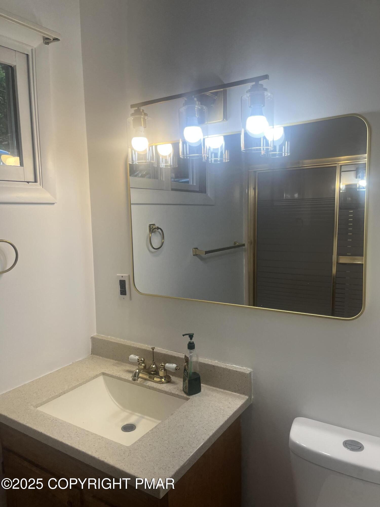 529 Pine Ridge Road Stroudsburg, PA 18360 - Photo 16 of 36 a bathroom with a sink and mirror