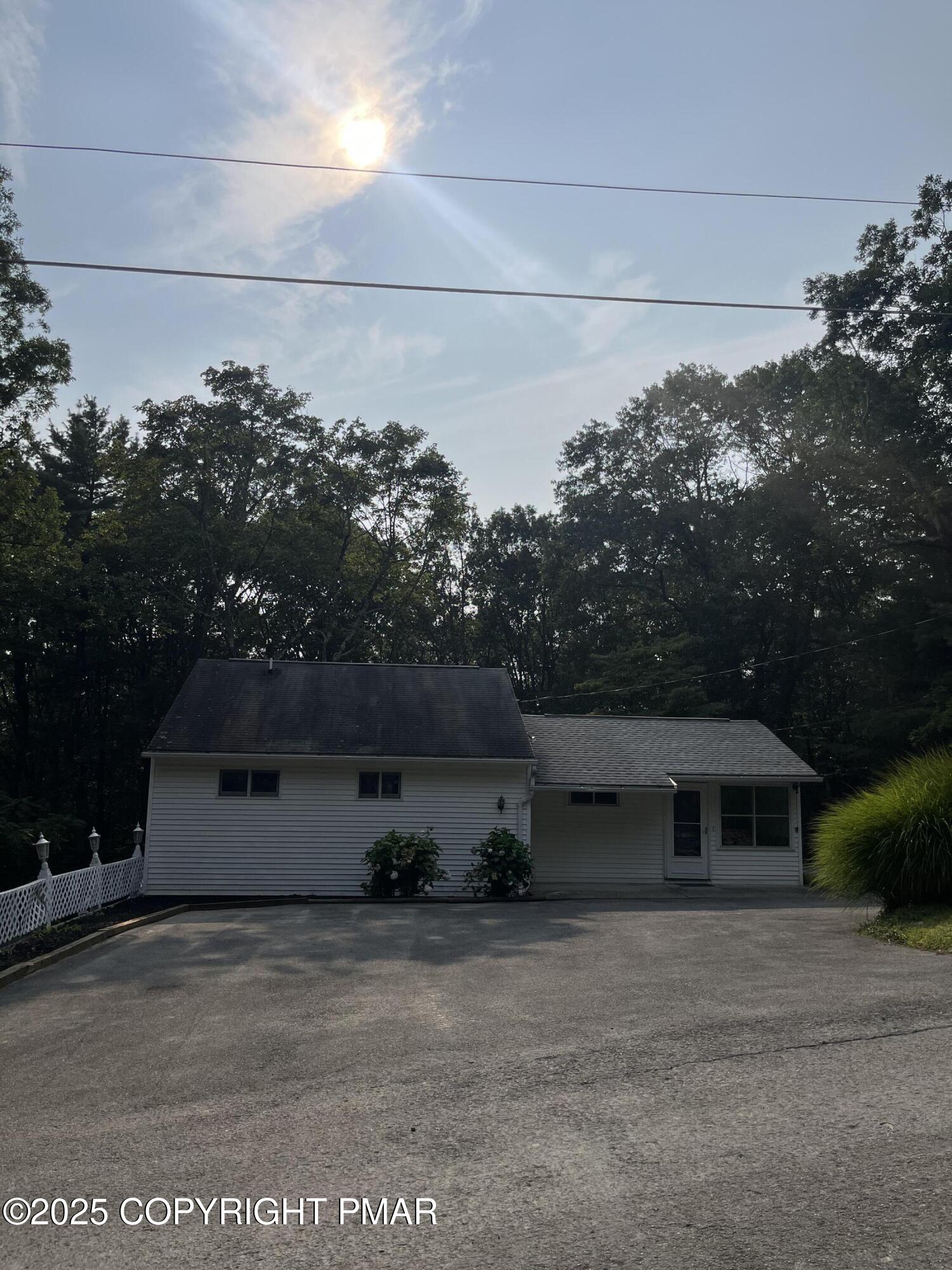 529 Pine Ridge Road Stroudsburg, PA 18360 - Photo 4 of 36 a front view of a house with a yard