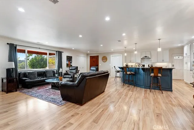 a room with pool table and windows