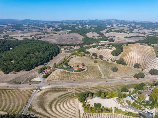 a large kitchen with lots of furniture a sink appliances and a dining table