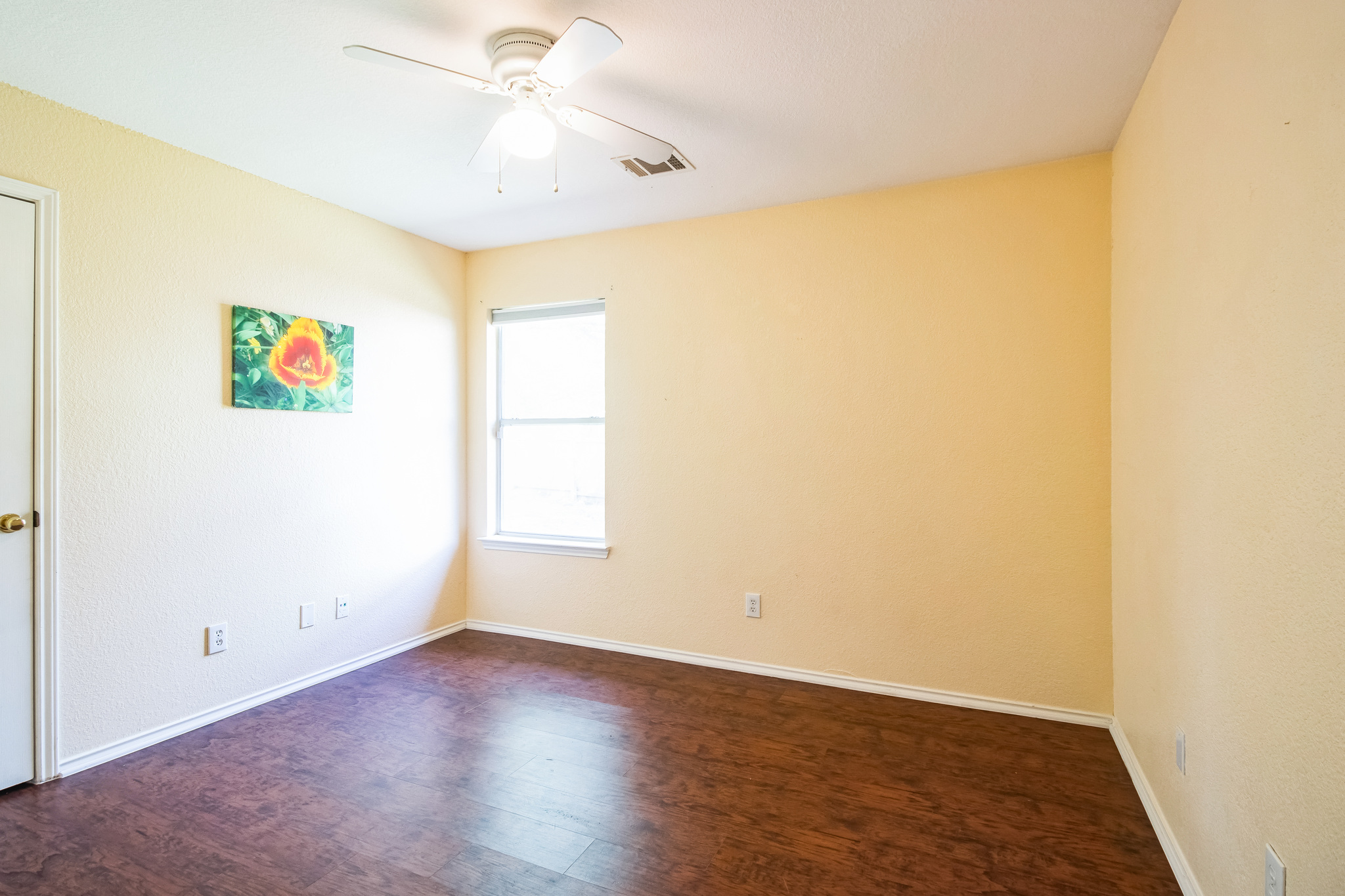12316 Sugar Leaf Place Austin, TX 78748 - Photo 11 of 16 an empty room with a window and a ceiling fan