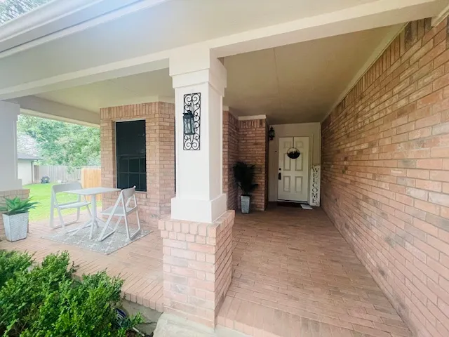 a view of front door with potted plant
