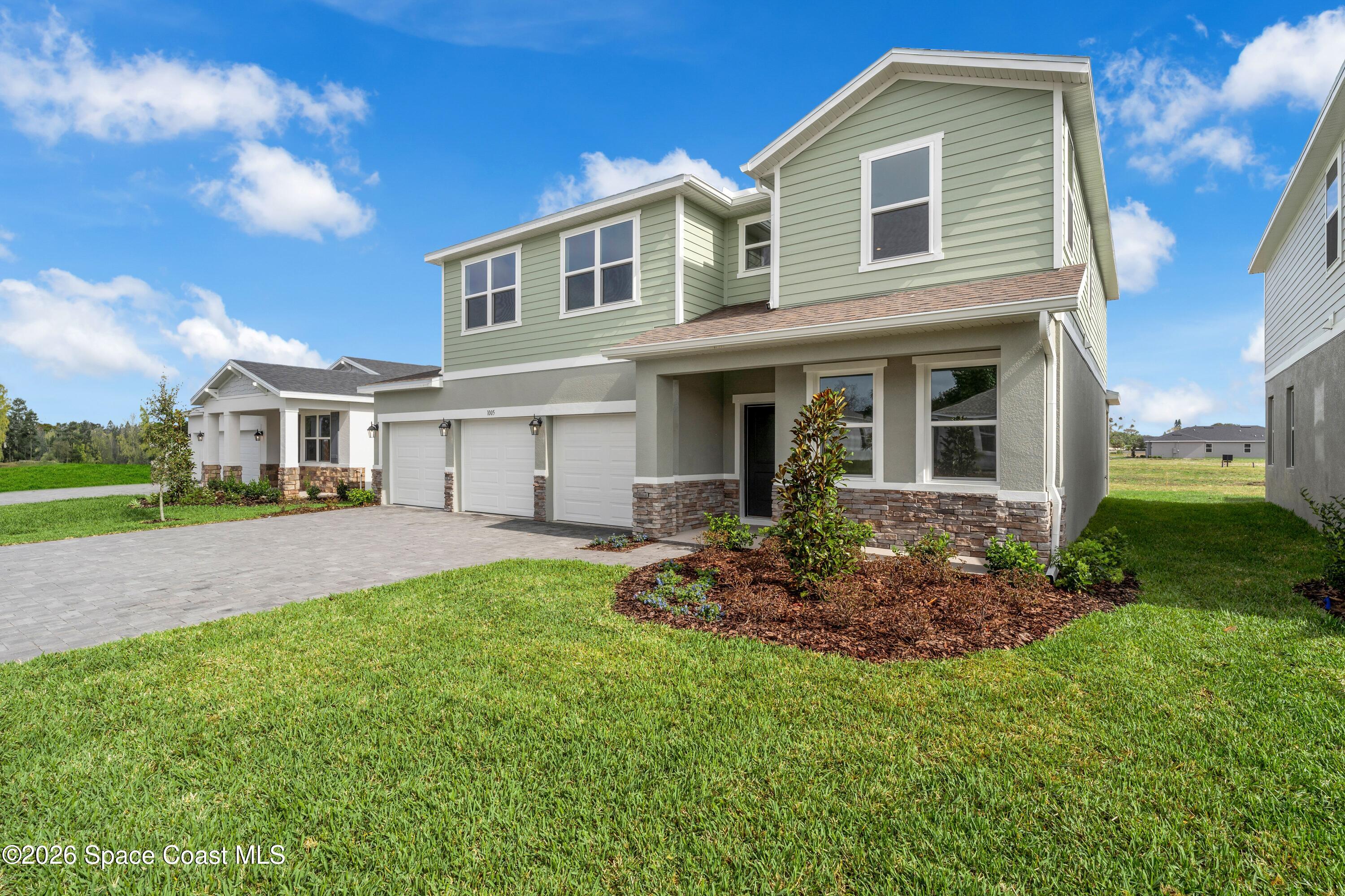 1005 Connolly Lane Northeast Palm Bay, FL 32905 - Photo 2 of 24 P_ORL_RCC_Chester_EXT_3QF_Lot 31_Elevati