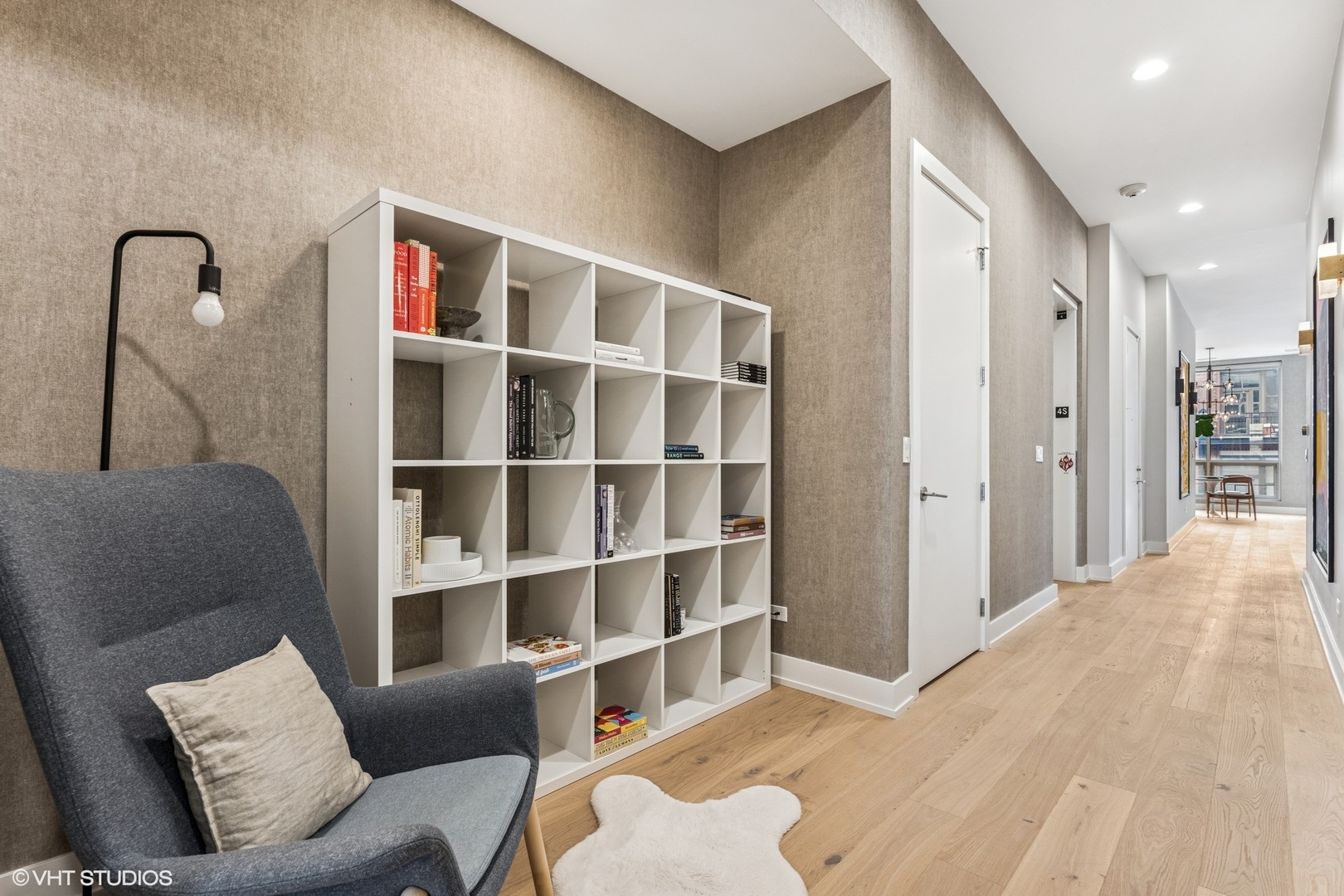 122 South Aberdeen Street, Unit 4S Chicago, IL 60607 - Photo 20 of 26 a living room with furniture and a window