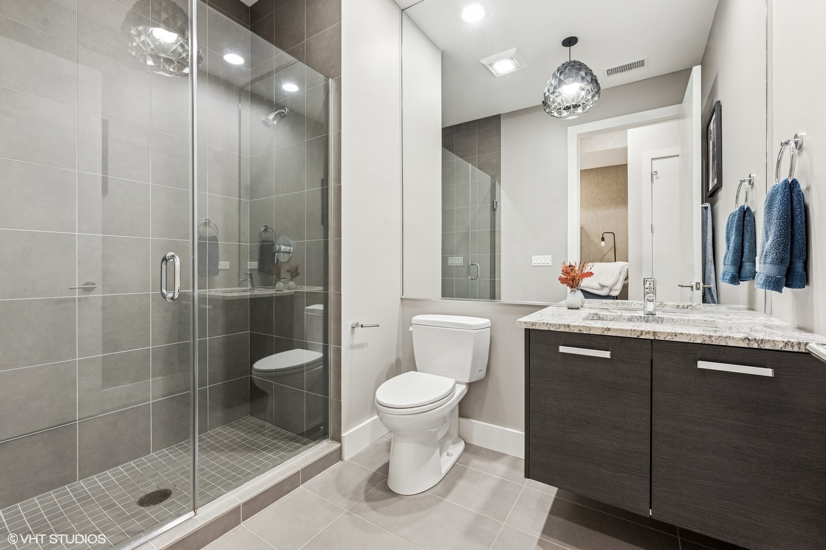 122 South Aberdeen Street, Unit 4S Chicago, IL 60607 - Photo 24 of 26 a bathroom with a sink toilet and shower