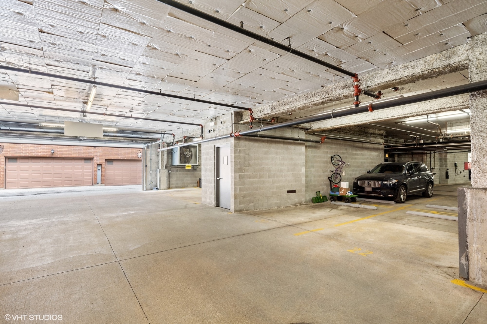122 South Aberdeen Street, Unit 4S Chicago, IL 60607 - Photo 25 of 26 a view of parking garage with cars