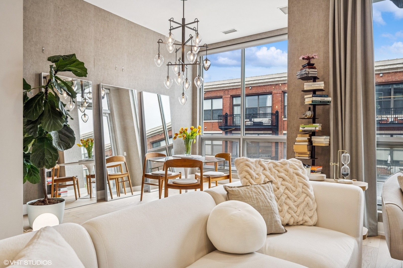 122 South Aberdeen Street, Unit 4S Chicago, IL 60607 - Photo 6 of 26 a living room with furniture a chandelier and a large window