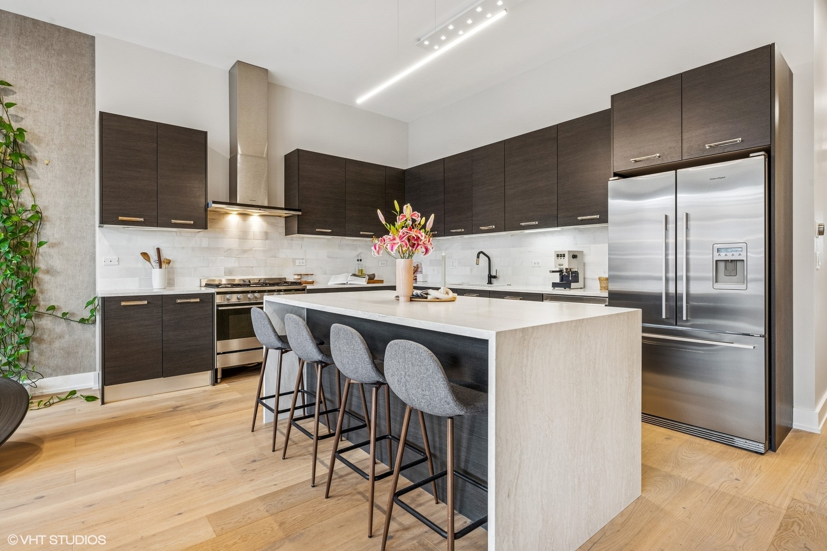 122 South Aberdeen Street, Unit 4S Chicago, IL 60607 - Photo 10 of 26 a kitchen with stainless steel appliances a sink and a refrigerator