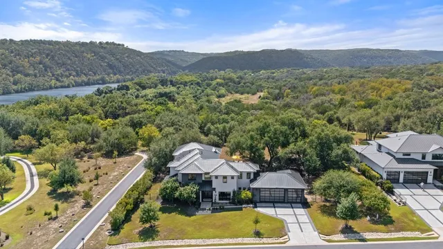 an aerial view of residential houses and outdoor space