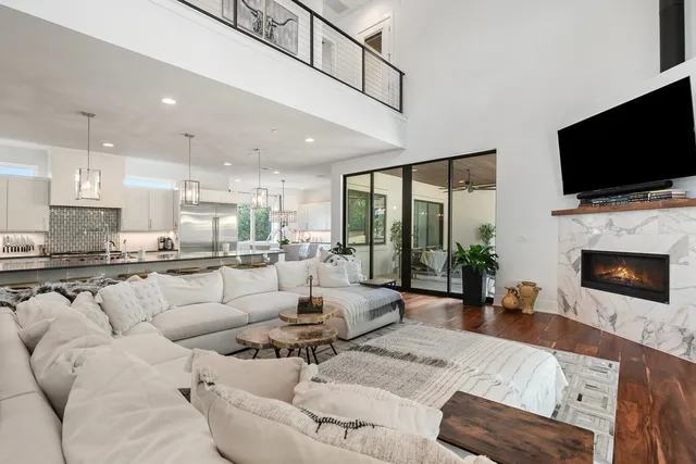 a living room with furniture fireplace and a flat screen tv