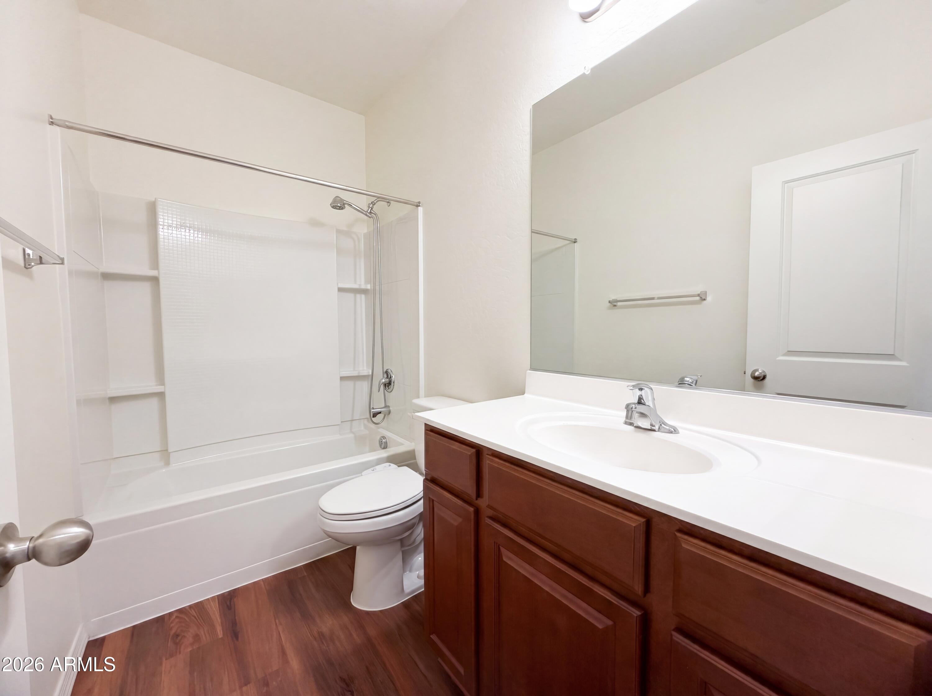 1738 South Aryelle Road Apache Junction, AZ 85119 - Photo 13 of 17 a bathroom with a sink a toilet and shower