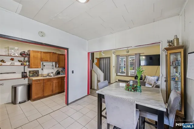 a kitchen with stainless steel appliances granite countertop a sink and a stove