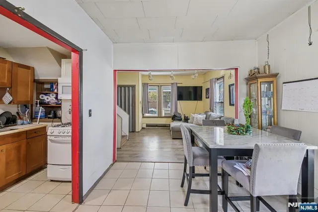 a bathroom with a tub a sink and a shower