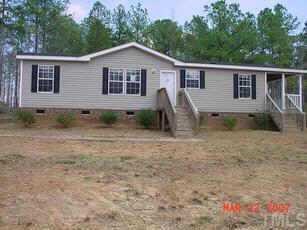 8423 South Creek Road Willow Spring, NC 27592 - Photo 1 of 1 a view of a house with backyard