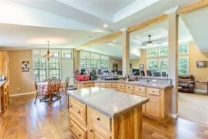 a view of a living room and chandelier or kitchen