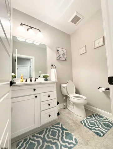 a bathroom with a shower and a sink