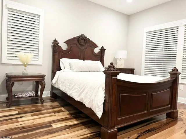 a bedroom with a bed and a dresser