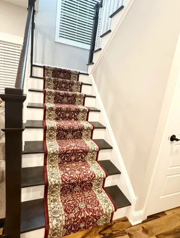 a bedroom with a bed and a ceiling fan