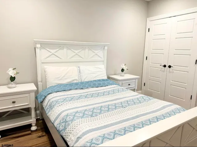 a bathroom with a sink vanity mirror and toilet