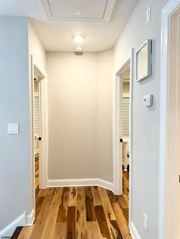 a bathroom with a shower and a sink a mirror