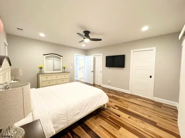 a bedroom with a bed and a table