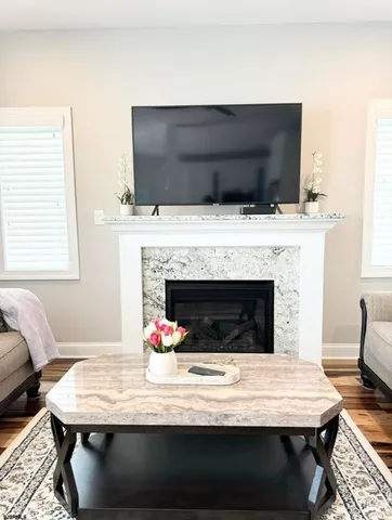 a kitchen with granite countertop a sink a counter space and cabinets