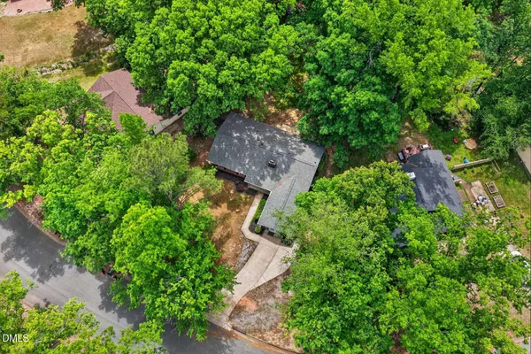 an aerial view of a house with a yard