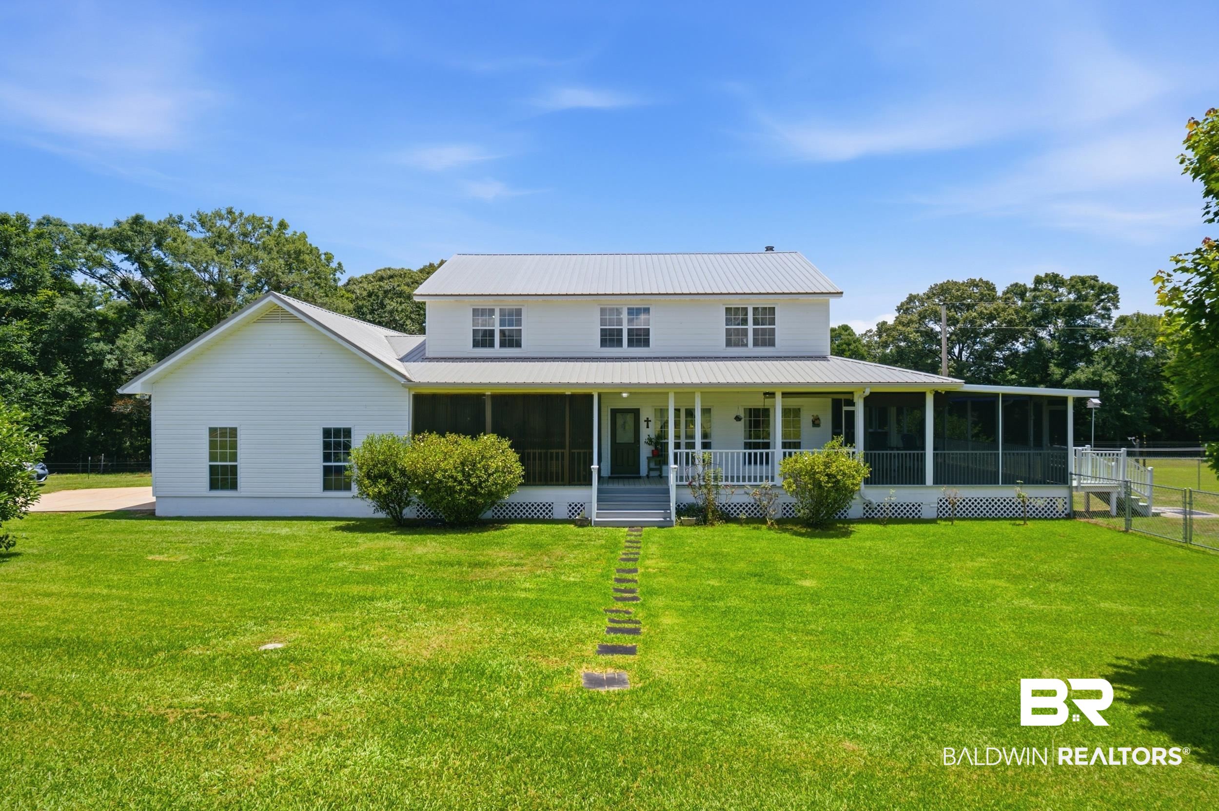 15855 Calvin Richerson Road Bay Minette, AL 36507 - Photo 3 of 83 Two-story residence featuring white siding and a light-colored metal roof