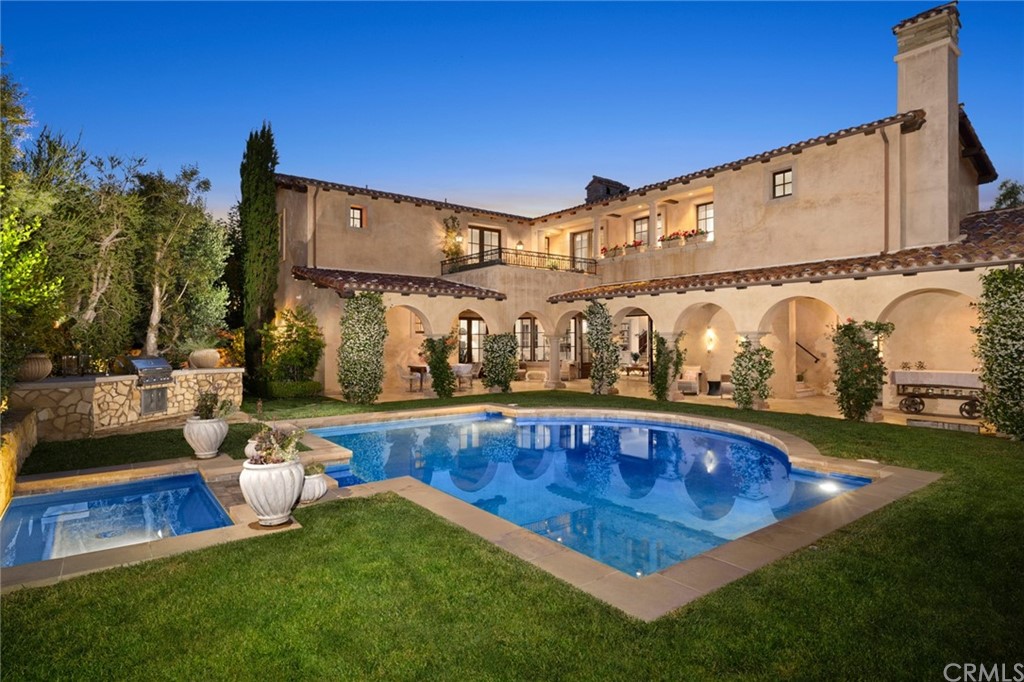 a view of swimming pool with outdoor seating and yard in the back