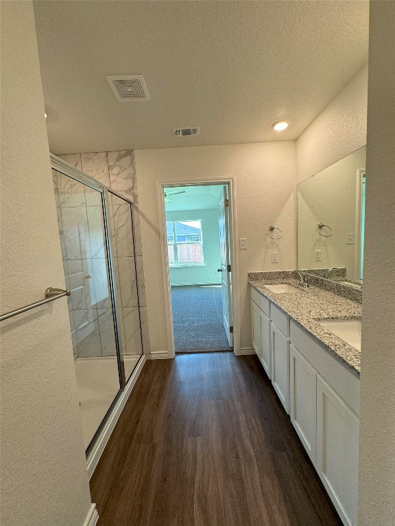 501 Double Vision Road Jarrell, TX 76537 - Photo 15 of 36 a view of a kitchen with wooden floor and electronic appliances