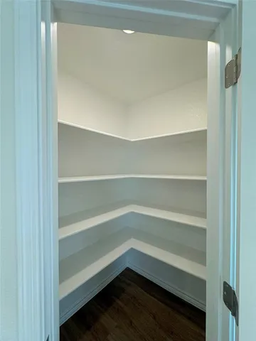 a storage room with wooden floor