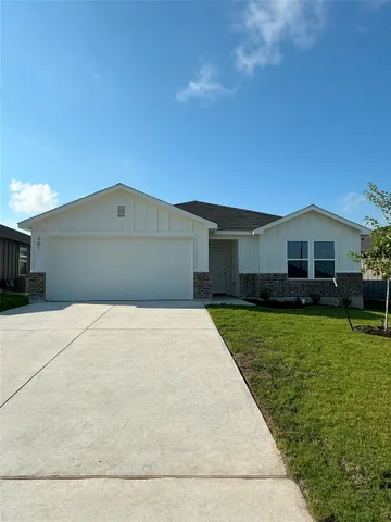 a front view of a house with yard