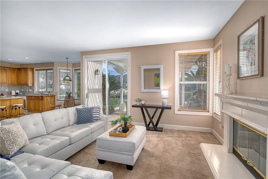24932 Normans Way Calabasas, CA 91302 - Photo 18 of 63 a living room with furniture and a fireplace