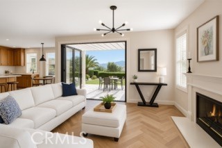 24932 Normans Way Calabasas, CA 91302 - Photo 19 of 63 a living room with furniture a flat screen tv and a fireplace