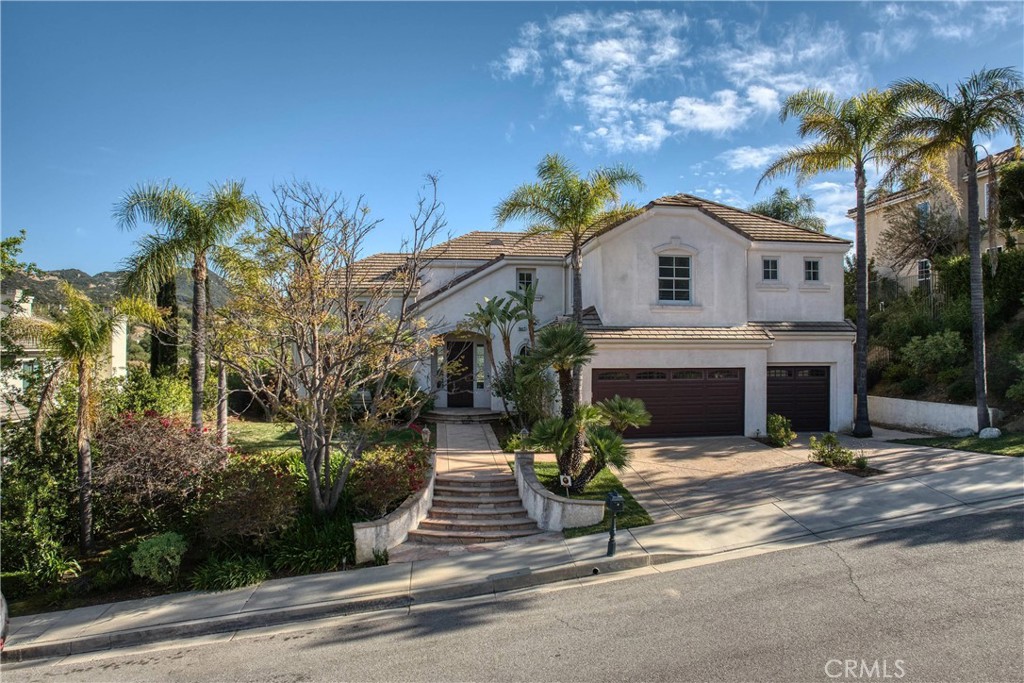 24932 Normans Way Calabasas, CA 91302 - Photo 2 of 63 a view of a house with a patio