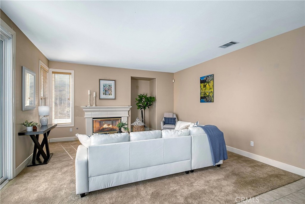 24932 Normans Way Calabasas, CA 91302 - Photo 21 of 63 a living room with furniture and a fireplace