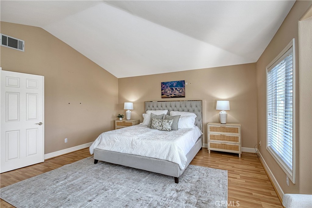 24932 Normans Way Calabasas, CA 91302 - Photo 29 of 63 a bedroom with a bed and a large window