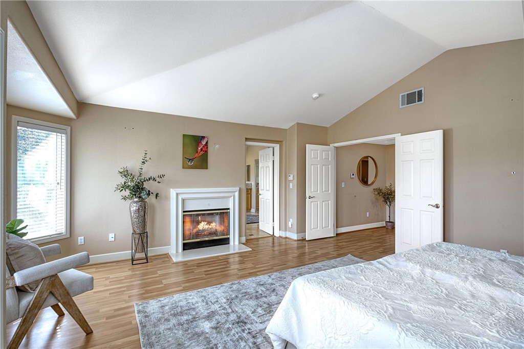 24932 Normans Way Calabasas, CA 91302 - Photo 30 of 63 a bedroom with a bed and a fireplace