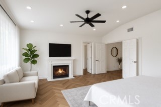 24932 Normans Way Calabasas, CA 91302 - Photo 31 of 63 a bedroom with a bed and a fireplace